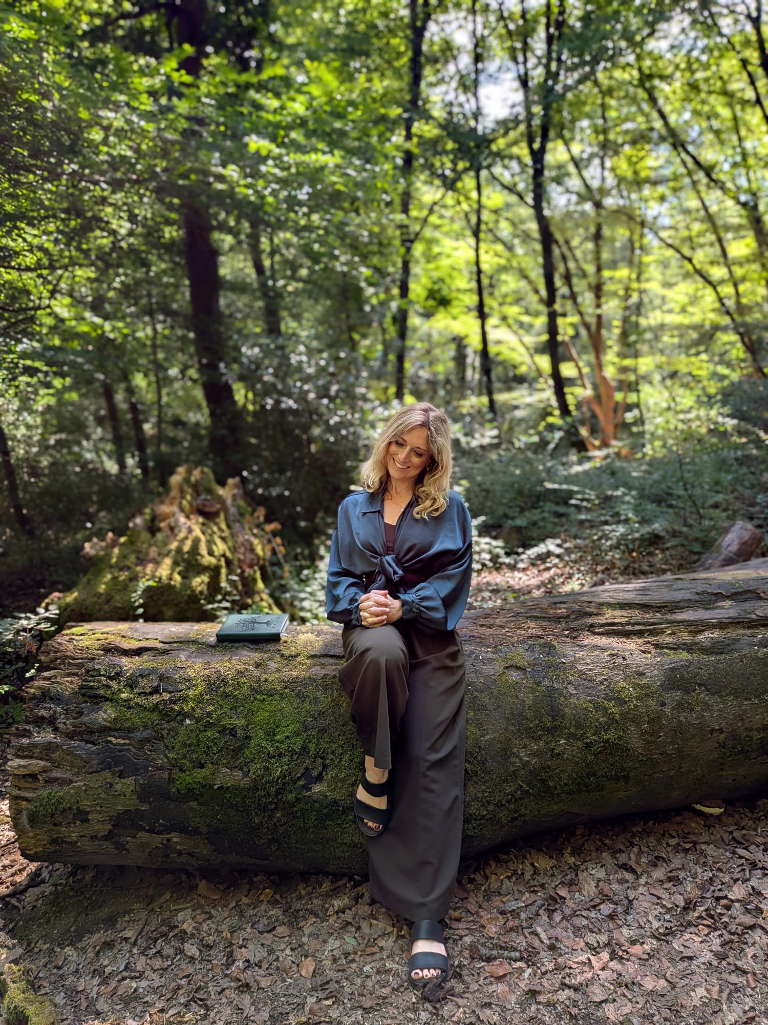Gemma Wood reading in the woods